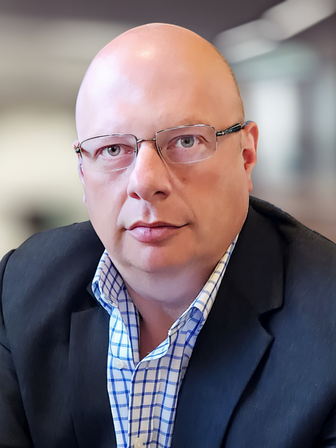 Professional headshot of Mark Starobinsky, technology advisor